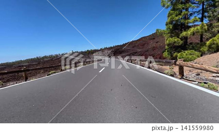 A Scenic Volcanic Road that is Surrounded by Lush and Beautiful Natural Environments A Scenic Volcanic Road that is Surrounded by Lush and Beautiful Natural Environments 141559980