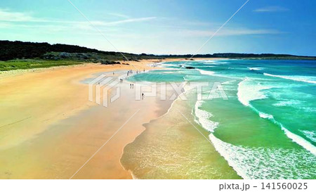 Stunning Aerial View of a Tropical Beach Featuring Magnificent, Clear Blue Waters Stunning Aerial View of a Tropical Beach Featuring Magnificent, Clear Blue Waters 141560025