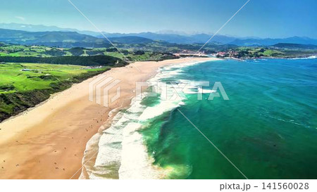 A Stunning Aerial View of a Serene Beach Set Against a Lush Green Landscape Awaiting You A Stunning Aerial View of a Serene Beach Set Against a Lush Green Landscape Awaiting You 141560028