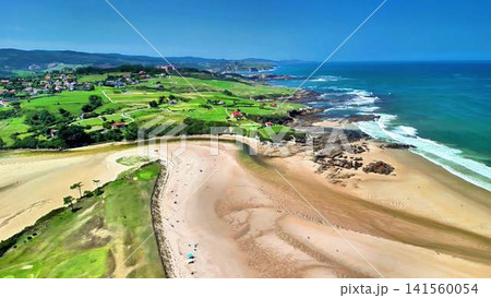 Breathtaking Coastal Views of a Peaceful Beach Surrounded by Lush Greenery and Scenic Hills Breathtaking Coastal Views of a Peaceful Beach Surrounded by Lush Greenery and Scenic Hills 141560054