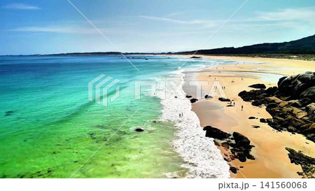 A beautiful beach with crystal clear water and a sandy shoreline perfect for relaxation 141560068
