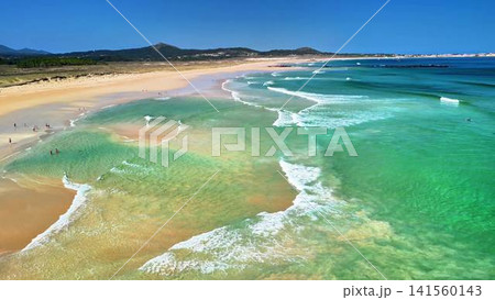 Breathtaking Aerial Perspective of a Tropical Beach Surrounded by Crystal Turquoise Waters 141560143