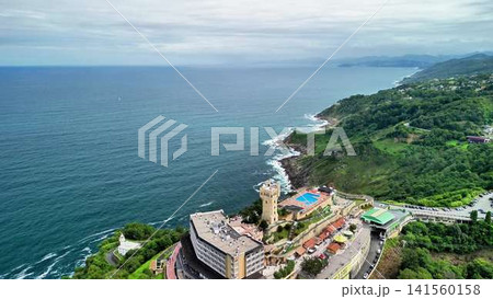 Overview of a Scenic Coastal Resort Featuring Stunning Ocean and Majestic Mountain View Overview of a Scenic Coastal Resort Featuring Stunning Ocean and Majestic Mountain View 141560158