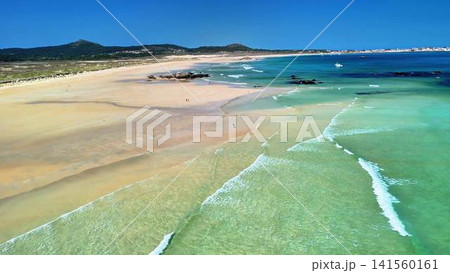 Experience the breathtaking and serene beach view with its clear waters and golden sandy shores Experience the breathtaking and serene beach view with its clear waters and golden sandy shores 141560161