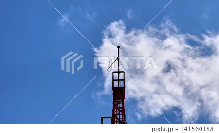 HighResolution and Detailed Images of a Communication Tower Surrounded by Fluffy Clouds HighResolution and Detailed Images of a Communication Tower Surrounded by Fluffy Clouds 141560188
