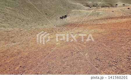 An Expansive Barren Landscape Featuring Rolling Hills with Various Earthy Tones Blending Together An Expansive Barren Landscape Featuring Rolling Hills with Various Earthy Tones Blending Together 141560201