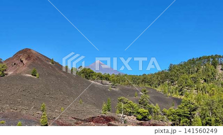Experience the stunning volcanic landscape with a clear blue sky, perfect for nature lovers Experience the stunning volcanic landscape with a clear blue sky, perfect for nature lovers 141560249