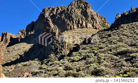Experience the Majestic and Breathtaking Rocky Landscape Beneath a Clear Blue Sky 141560252