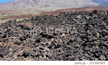 A Stunning Lava Landscape with a Majestic Mountain View Showing the Natural Beauty A Stunning Lava Landscape with a Majestic Mountain View Showing the Natural Beauty 141560303