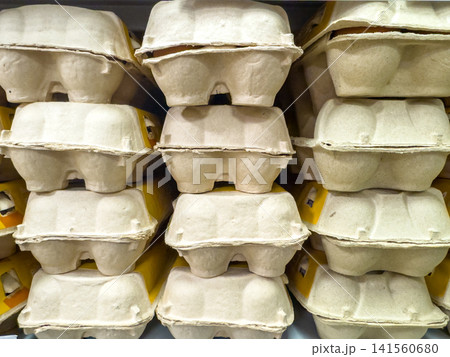 Stacked cardboard egg cartons in a grocery display Stacked cardboard egg cartons in a grocery display 141560680