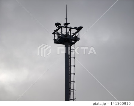 Facility inspection under cloudy sky. Maintenance structure equipped for safety and repair tasks Facility inspection under cloudy sky. Maintenance structure equipped for safety and repair tasks 141560910