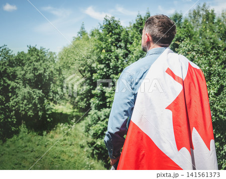 Construction worker and Canadian flag Construction worker and Canadian flag 141561373