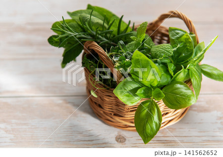 Basket of fresh garden herbs for cooking Basket of fresh garden herbs for cooking 141562652