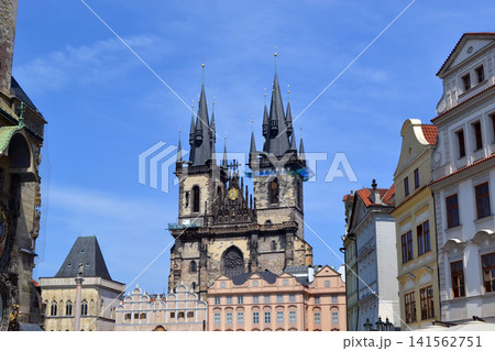 Gothic twin spire tyn church above old town buildings in Prague for travel background and architecture poster. Church of the Mother of God before Tyn Gothic twin spire tyn church above old town buildings in Prague for travel background and architecture poster. Church of the Mother of God before Tyn 141562751