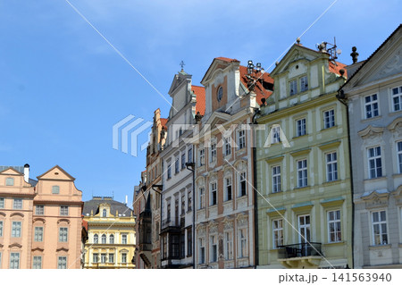 Row of pastel historic townhouses with ornate facades and red tile roofs for city background and travel poster design. Old Town Square of Prague 141563940