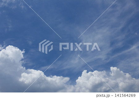 It is a blue sky with fluffy clouds. It is a blue sky with fluffy clouds. 141564269