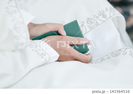 wedding rings on the bride and groom on a white background 141564510