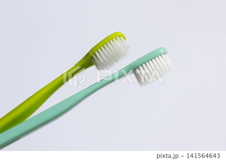 This is a collection of colorful toothbrushes. 141564643