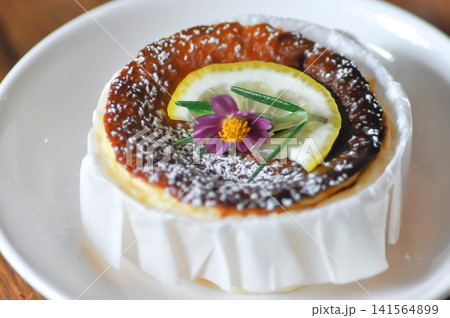 cheesecake or basque cheesecake , piece of cake or lemon cheesecake oe cheesecake with lemon topping 141564899