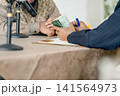 architect working on drawing pad 141564973