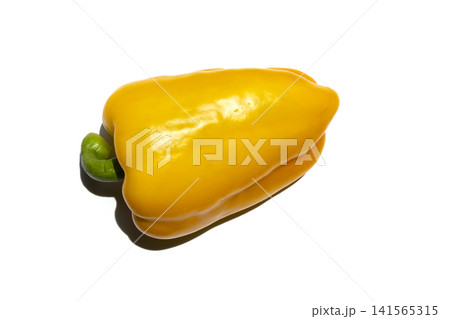 It is a bell pepper placed on a white background. It is a bell pepper placed on a white background. 141565315