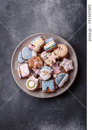 Gingerbread as a Christmas staple, sweet biscuits for the holiday. Gingerbread as a background 141565905