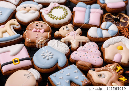 Gingerbread as a Christmas staple, sweet biscuits for the holiday. Gingerbread as a background Gingerbread as a Christmas staple, sweet biscuits for the holiday. Gingerbread as a background 141565919