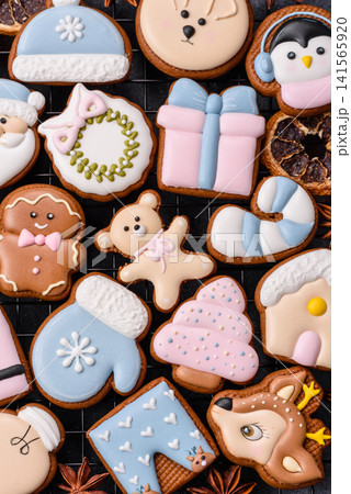 Gingerbread as a Christmas staple, sweet biscuits for the holiday. Gingerbread as a background Gingerbread as a Christmas staple, sweet biscuits for the holiday. Gingerbread as a background 141565920