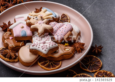 Gingerbread as a Christmas staple, sweet biscuits for the holiday. Gingerbread as a background 141565929
