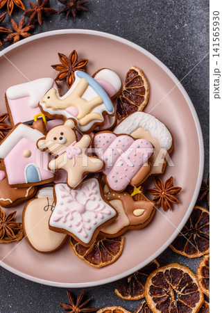 Gingerbread as a Christmas staple, sweet biscuits for the holiday. Gingerbread as a background 141565930