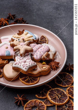 Gingerbread as a Christmas staple, sweet biscuits for the holiday. Gingerbread as a background Gingerbread as a Christmas staple, sweet biscuits for the holiday. Gingerbread as a background 141565931