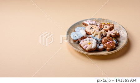 Gingerbread as a Christmas staple, sweet biscuits for the holiday. Gingerbread as a background Gingerbread as a Christmas staple, sweet biscuits for the holiday. Gingerbread as a background 141565934