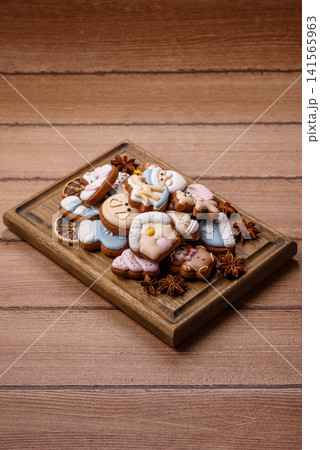 Gingerbread as a Christmas staple, sweet biscuits for the holiday. Gingerbread as a background Gingerbread as a Christmas staple, sweet biscuits for the holiday. Gingerbread as a background 141565963