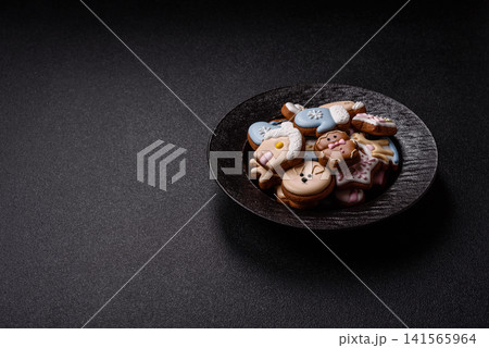 Gingerbread as a Christmas staple, sweet biscuits for the holiday. Gingerbread as a background 141565964