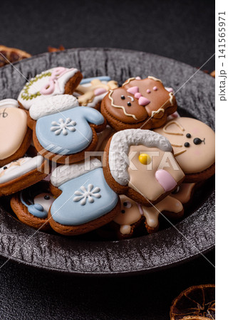 Gingerbread as a Christmas staple, sweet biscuits for the holiday. Gingerbread as a background Gingerbread as a Christmas staple, sweet biscuits for the holiday. Gingerbread as a background 141565971