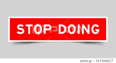 Red color square shape sticker label with word stop doing on gray background Red color square shape sticker label with word stop doing on gray background 141566627
