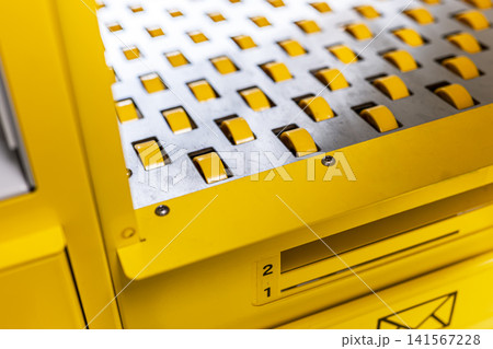 Industrial conveyor roller bed system in a self service postal kiosk, illustrating efficient public service automation. Industrial conveyor roller bed system in a self service postal kiosk, illustrating efficient public service automation. 141567228