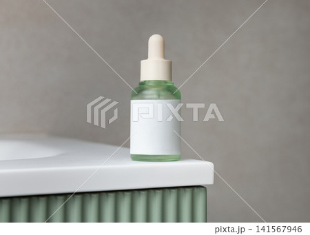 White spray cosmetic bottle mockup on green bathroom vanity. Skincare cosmetic packaging 141567946