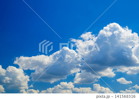 dense white clouds in the lower part of a blue sky dense white clouds in the lower part of a blue sky 141568316