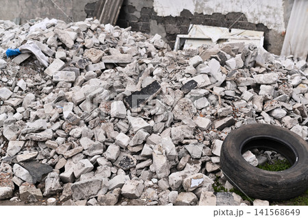Messy heap of construction waste stands on ground after destruction. Messy heap of construction waste stands on ground after destruction. 141568649