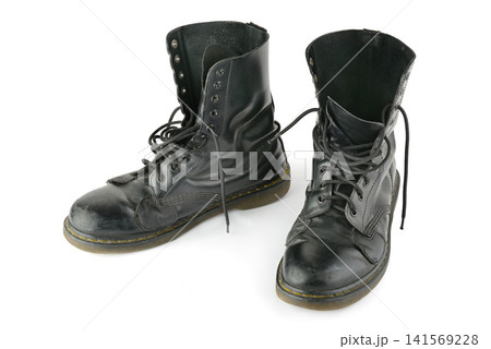 Pair of Worn Black Leather High Top Work Boots Isolated Against Pure White Background 141569228