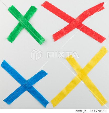 Four colored tape crosses on a white surface Four colored tape crosses on a white surface 141570338