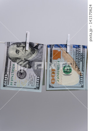 Two Dollar Bills Hanging Upside Down on Clothesline For Money Laundering Two Dollar Bills Hanging Upside Down on Clothesline For Money Laundering 141570624