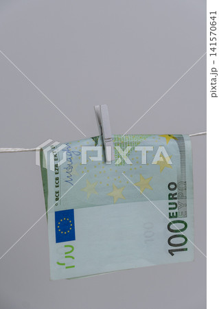 Close Up of One Hundred Euro Banknote on Rope for Money Laundering Concept Close Up of One Hundred Euro Banknote on Rope for Money Laundering Concept 141570641