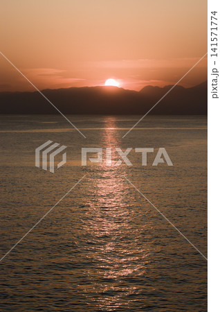 Sunset over the sea and sea candle seen from the Enoshima island 141571774