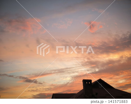 A house under the endless sky at sunset A house under the endless sky at sunset 141571883