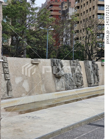 Cordoba, Argentina - April 11, 2026: Historical Relief Panels Along Plaza Espana Wall Cordoba, Argentina - April 11, 2026: Historical Relief Panels Along Plaza Espana Wall 141572152