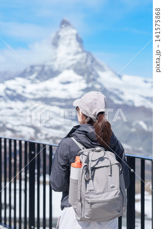 Woman Tourist Exploring Zermatt, Switzerland. happy Traveler sightseeing iconic Matterhorn Swiss Alps Viewpoint, Famous European Landmark, Popular Tourist Attraction and Travel Destination in Europe Woman Tourist Exploring Zermatt, Switzerland. happy Traveler sightseeing iconic Matterhorn Swiss Alps Viewpoint, Famous European Landmark, Popular Tourist Attraction and Travel Destination in Europe 141575868