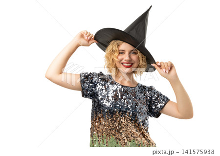 Woman in witch hat enjoys Halloween, isolated on white, PNG Woman in witch hat enjoys Halloween, isolated on white, PNG 141575938