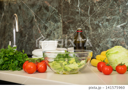 Cooking. Chef prepares healthy food using fresh vegetables for homemade salad Cooking. Chef prepares healthy food using fresh vegetables for homemade salad 141575960